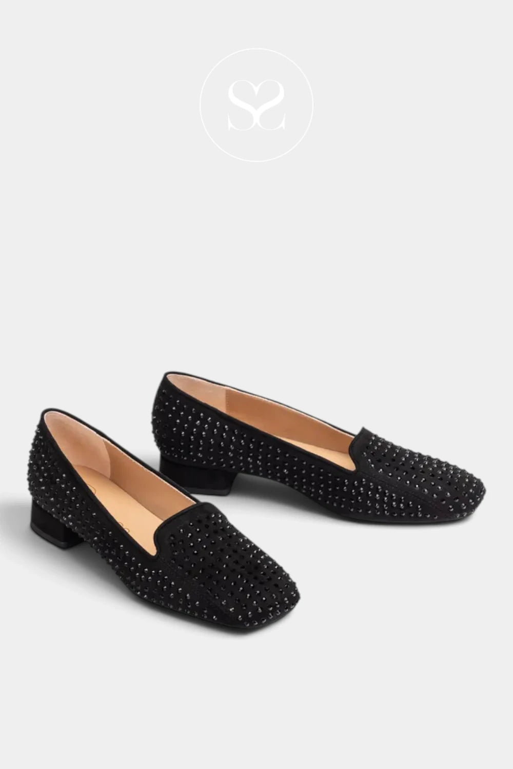 A pair of black low-heeled loafers embellished with silver rhinestones, displayed on a light gray background with a brand logo watermark at the top.