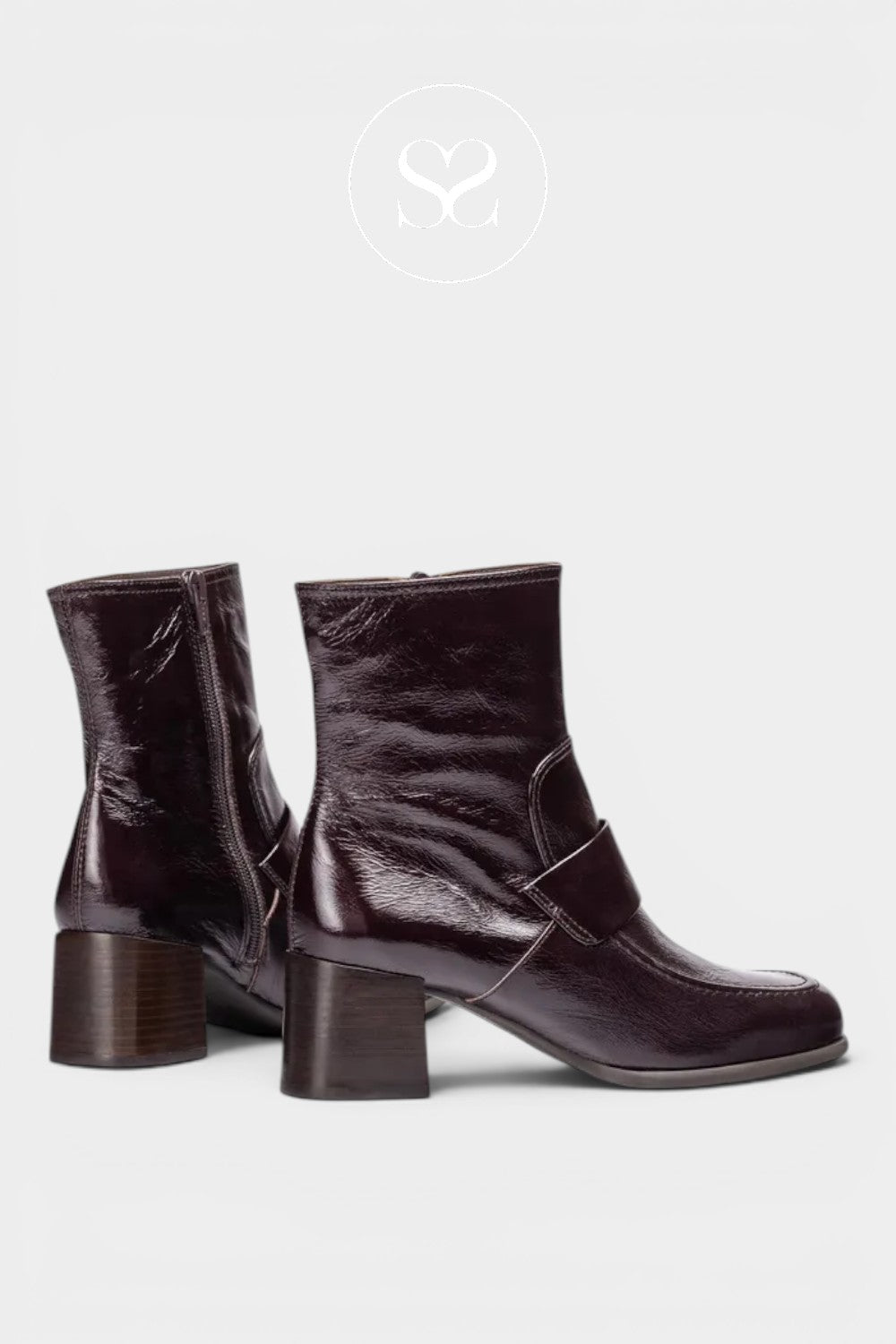 Pair of Unisa boots. Spanish leather boots in brown patent with block heel. Dressy boots for work or events.