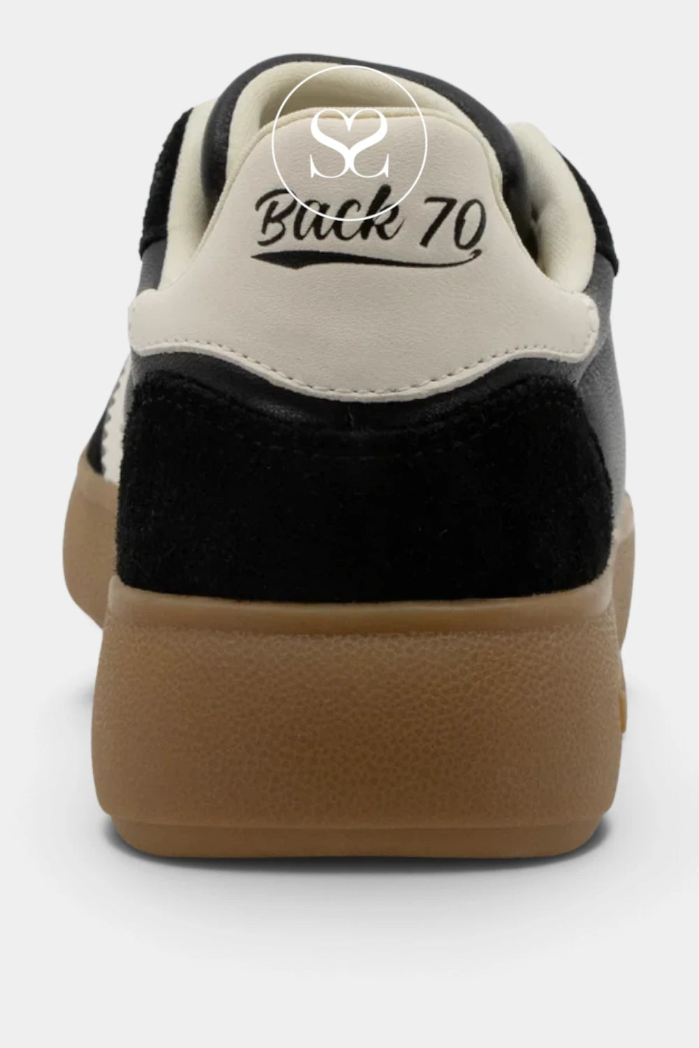 Close-up rear view of a low-top sneaker with a cream leather upper, black suede overlays, and a thick tan gum sole. The heel tab shows the text 'Back 70' in black script.