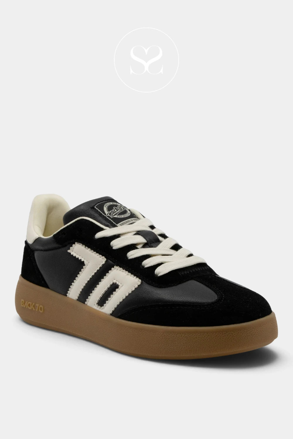 A black and brown low-top sneaker with white side stripes and white laces, shown from a three-quarters angle on a light gray background.