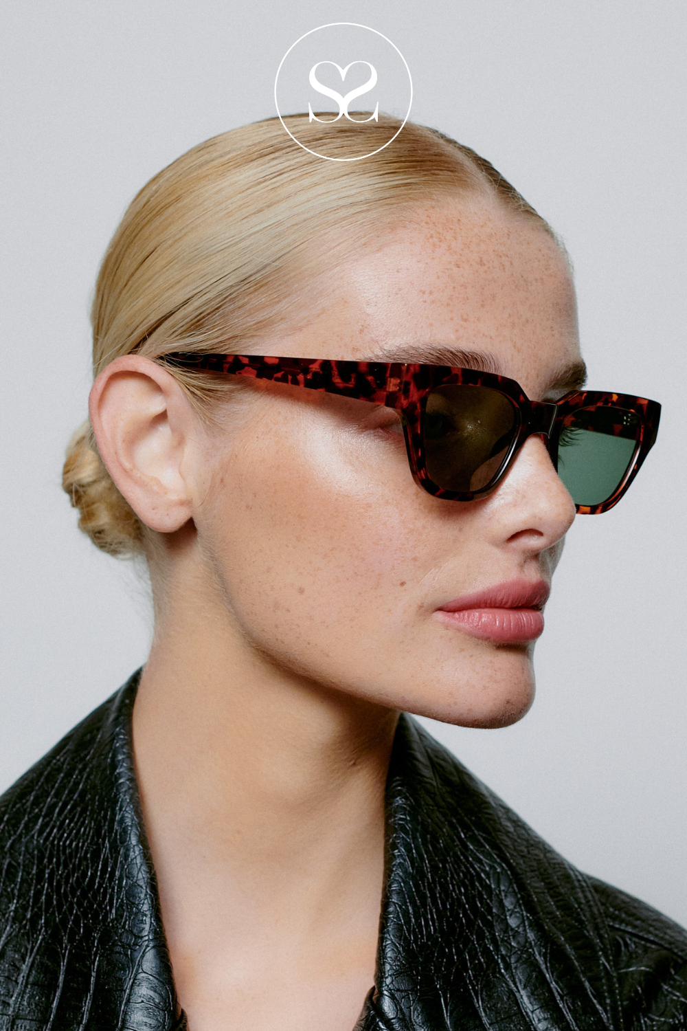 woman wearing kaws sunglasses