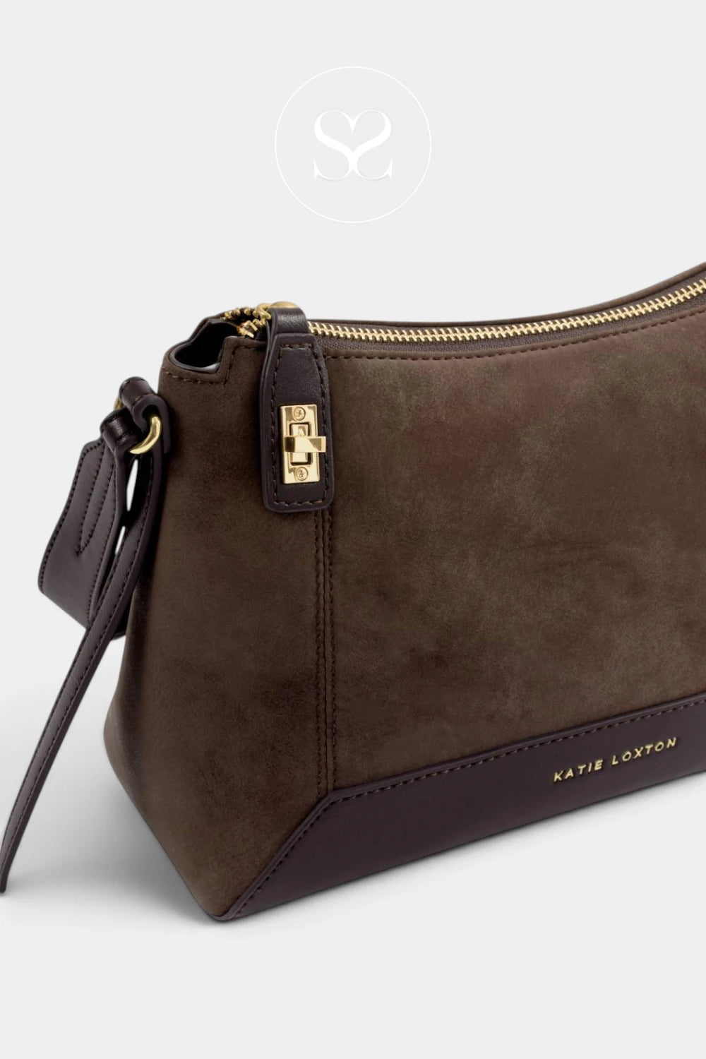 A close-up of a Kayie Loxton brown suede shoulder bag with a dark brown leather base, gold zipper, and a small gold logo clasp, set against a light gray background.