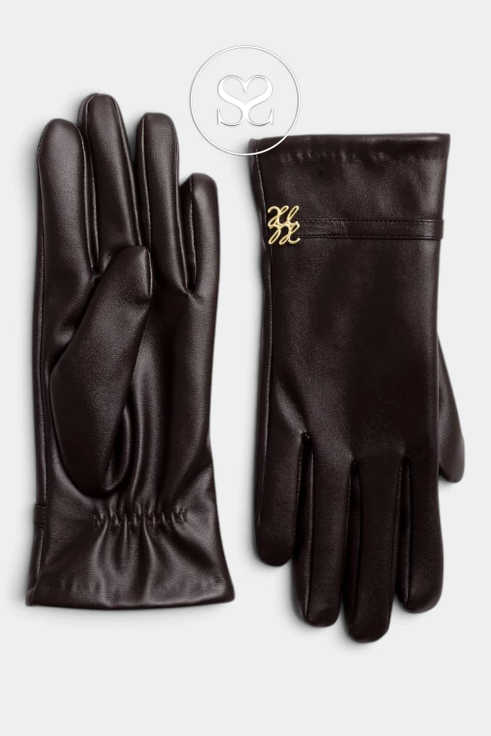 A pair of dark brown leather gloves, one showing the back of the hand with elasticized cuffs and the other showing the palm side, featuring a small gold-tone logo on the cuff, set against a light gray background.