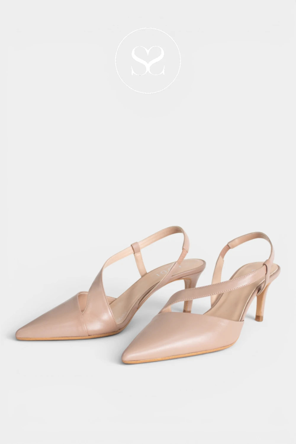 A pair of pointed-toe slingback heels in a light nude pink leather, displayed against a light gray background with a faint logo at the top.