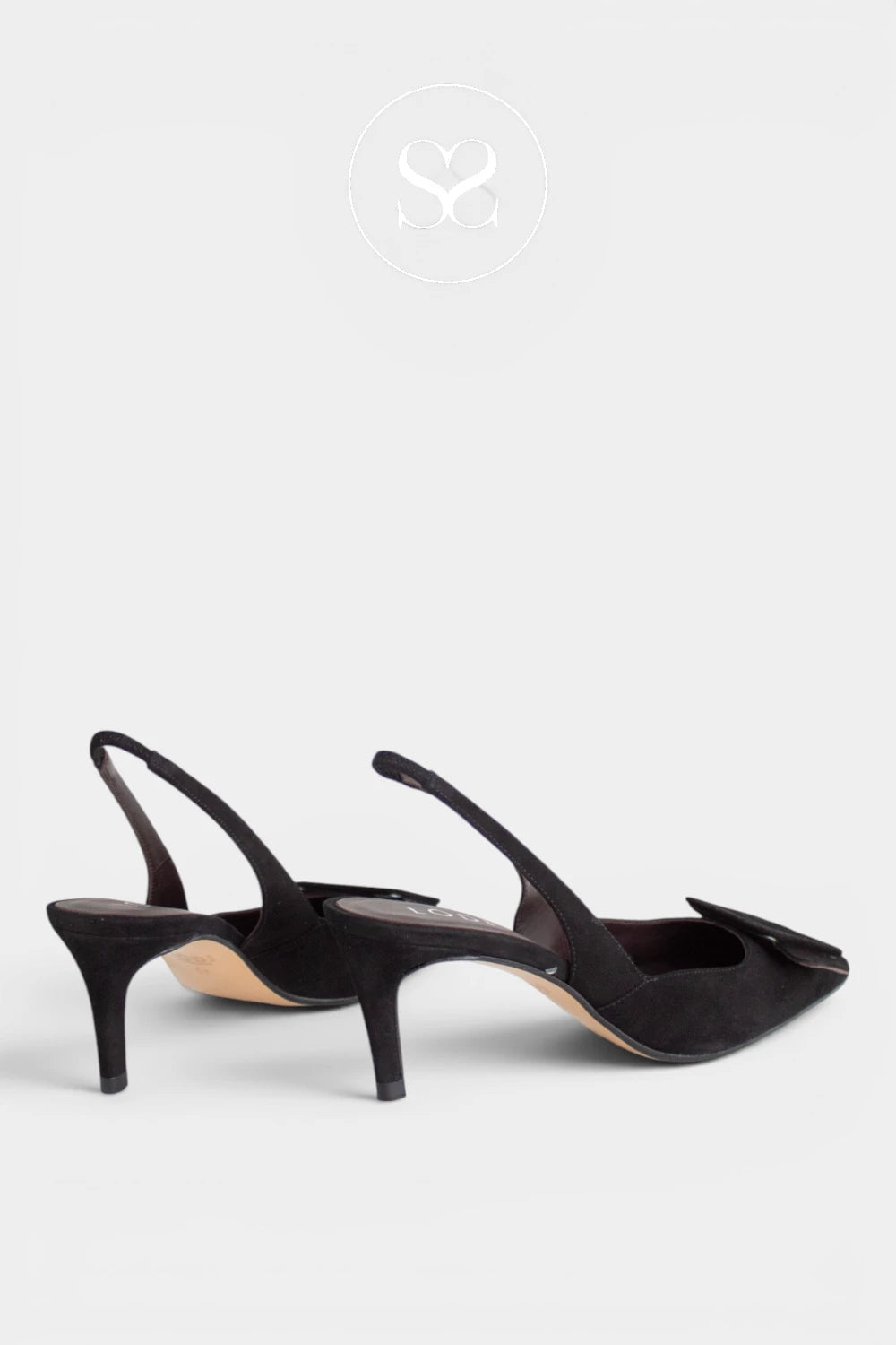  Lodi Nestor slingback court shoe is crafted in rich black suede with a pointed toe and a square buckle detail to the front. Finished with a 6.5cm heel and an elasticated slingback strap, it is designed for occasion wear, party dressing and smarter work days where a lower heel is needed. 
