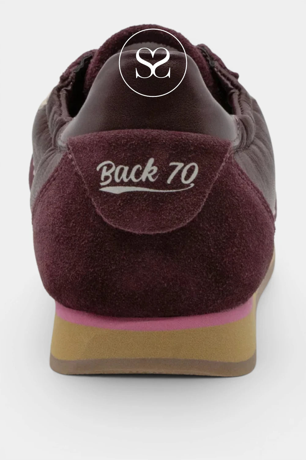 Close-up rear view of a burgundy suede sneaker with a tan and pink sole, featuring 'Back 70' embroidered on the heel and a circular 'SC' logo on the tongue.