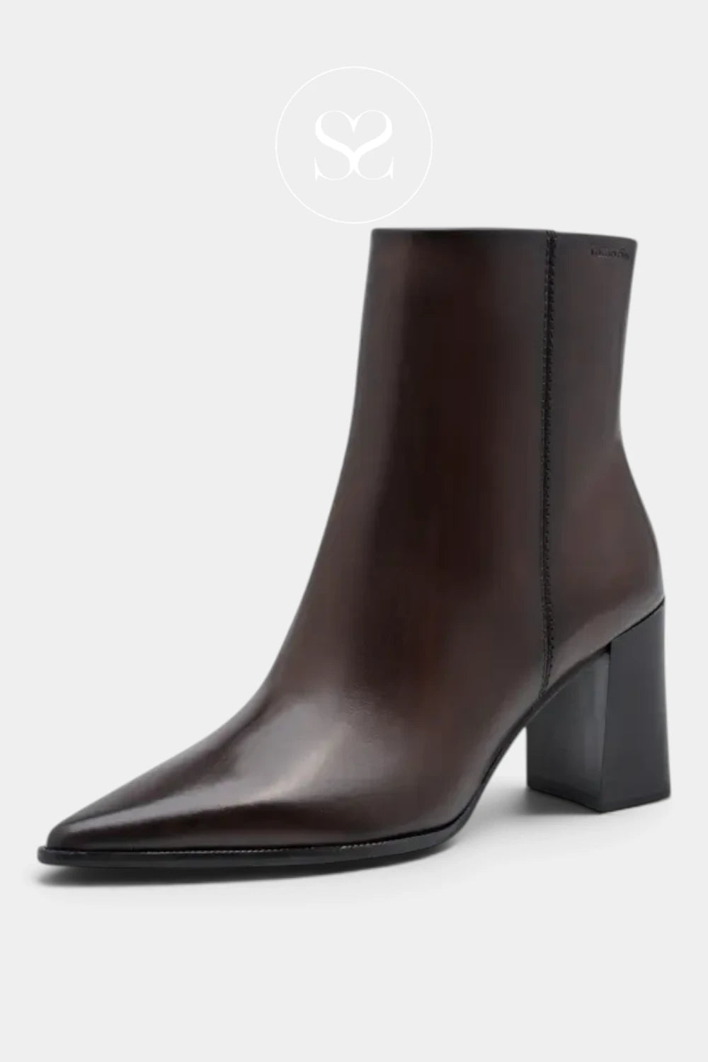A dark brown leather ankle boot with a pointed toe and a chunky block heel, shown from a three-quarters angle on a light gray background.