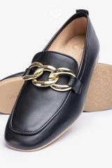 black loafers with low block heel and gold buckel detail