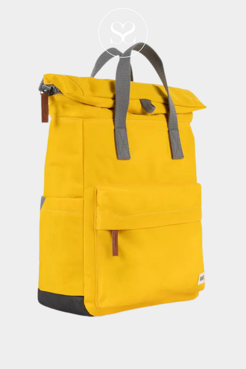 ROKA CANFIELD B YELLOW WATERPROOF BACKPACK BAG WITH GREY STRAP AND FRONT ZIP POCKET
